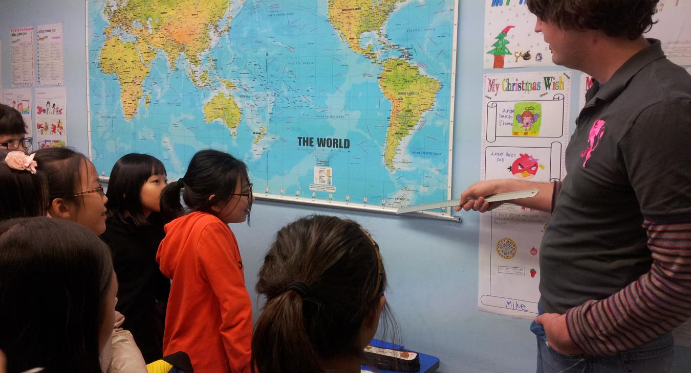 Pointing to world map