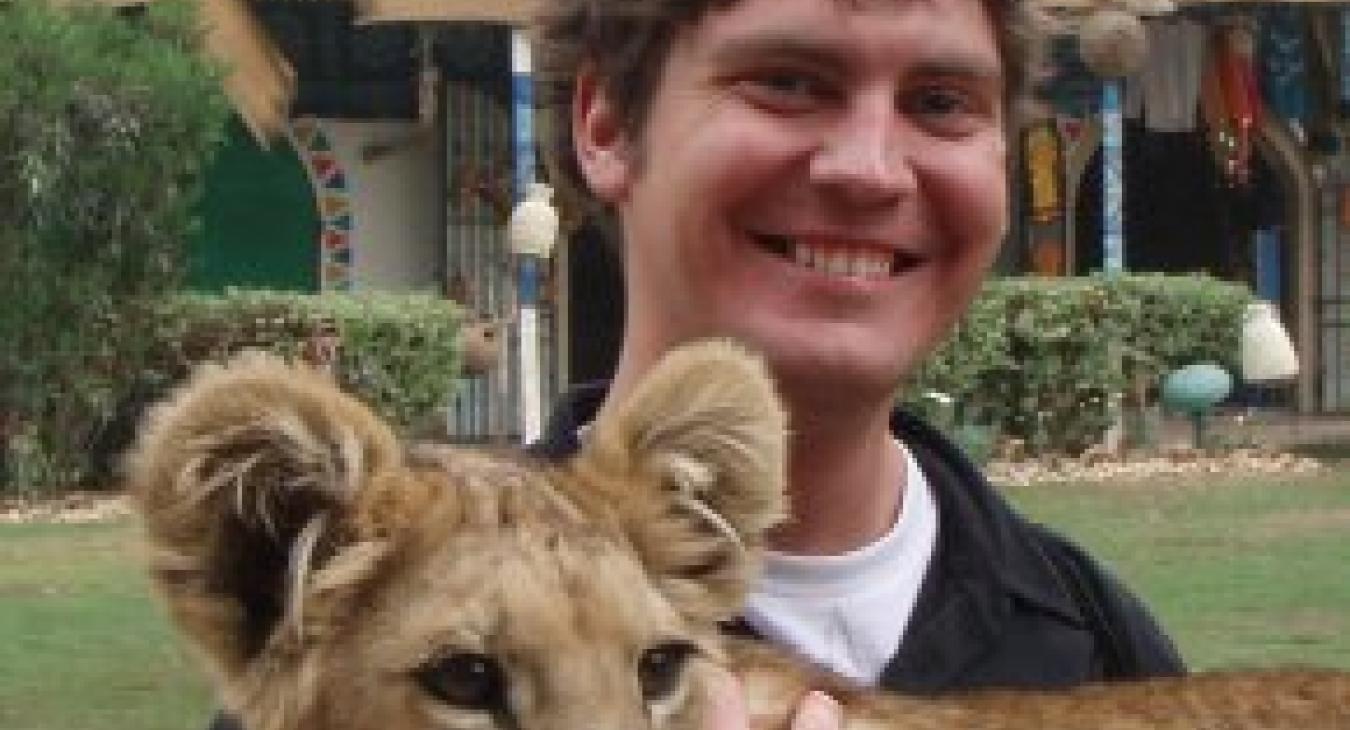 Dallas holding a lion